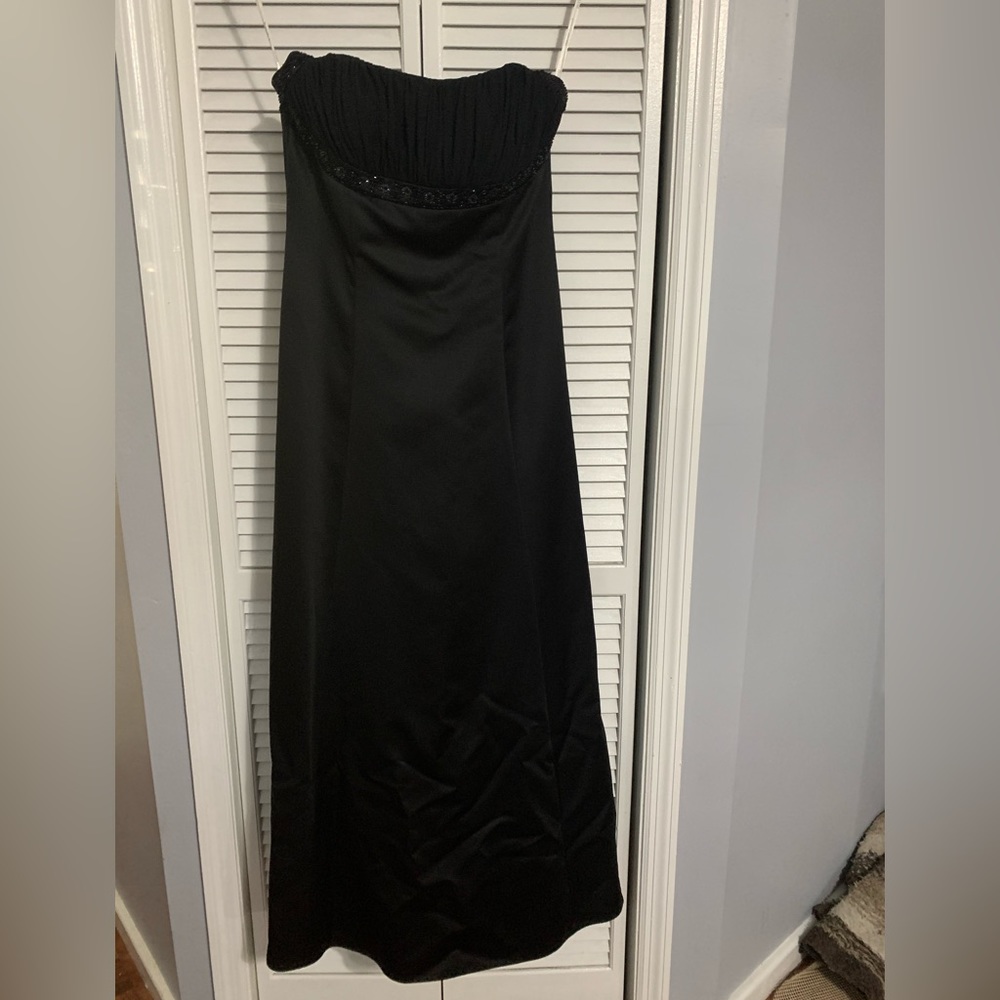 Black halter formal dress. Beaded halter and ruched bodice. Size 14.